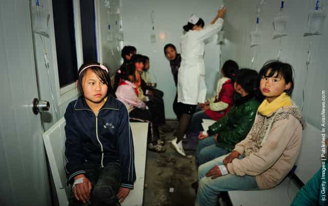 Students receive treatments at a local hospital in Zhijin County, Guizhou Province of China