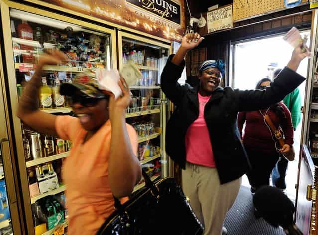 Sierra Luchien and Tammy Redlen are jubilant as they walk into the Blue Bird liquor store after waiting in line for nearly three hours to purchase their Mega Millions lottery ticket on March 29, 2012, in Hawthorne, Calif. There were three winning tickets sold for the record $656 million jackpot, but none were in California