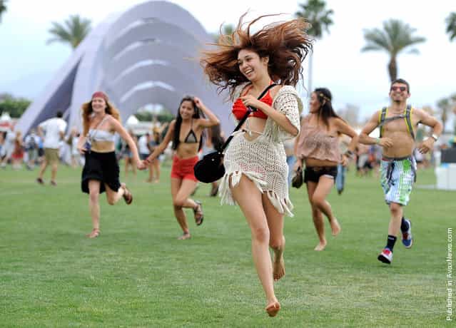 Festival goers run toward the main stage to catch the beginning of Kendrick Lamars set during the first weekend of Coachella 2012, on April 13, 2012