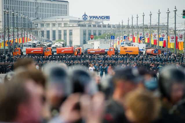 Riot police hauled away dozens of protesters and at least two opposition leaders on Sunday after scuffles broke out at a demonstration against Vladimir Putin’s return to Russia’s presidency, witnesses said