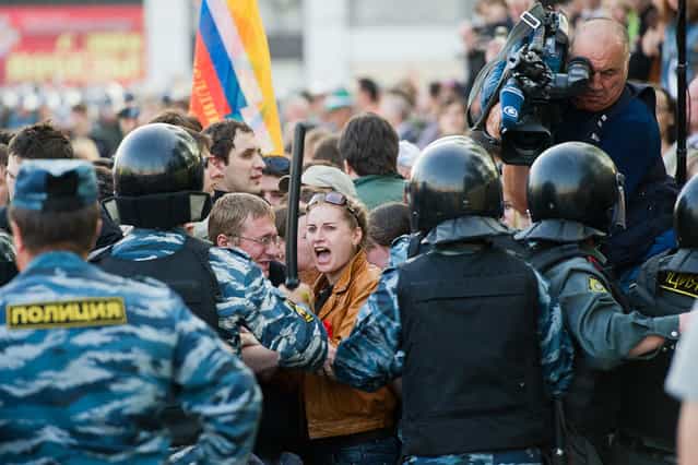 Riot police hauled away dozens of protesters and at least two opposition leaders on Sunday after scuffles broke out at a demonstration against Vladimir Putin’s return to Russia’s presidency, witnesses said