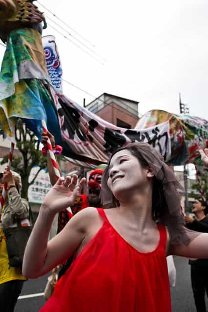 Women dance, in the style of Japanese butoh dancing, as the Zero Nuclear Power Celebration Parade makes its way through the streets of Suginami district, on May 6, 2012 in Tokyo, Japan