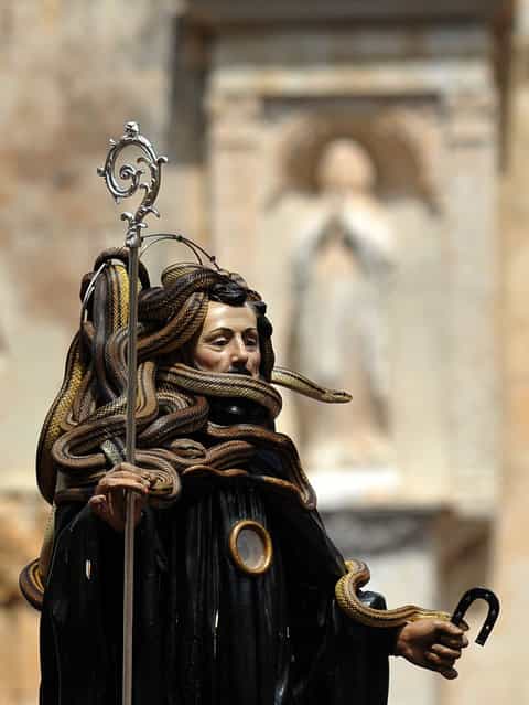 A statue of Saint Domenico surrounded by snakes is held up by worshippers during an annual procession dedicated to the saint, in the streets of Cocullo, in the Abruzzo region, on May 1, 2012
