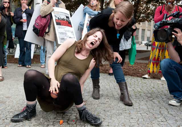 Midwifes simulate a childbirth as they stage a flashmob on May 5, 2012 in front of the Health Ministry in Berlin. They demonstrated against rising contributions to professional indemnity insurances