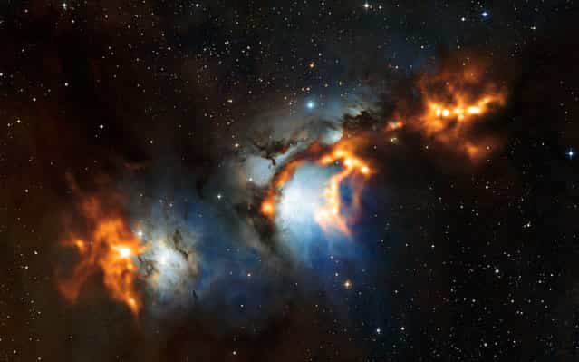 A handout picture released by the European Southern Observatory (ESO) shows cosmic dust clouds in Messier 78