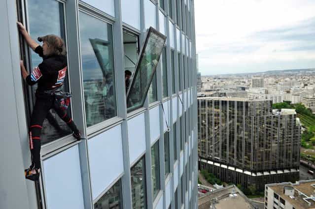 Alain Robert Climbs The First Tower In Paris