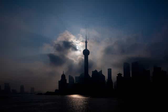 An eclipse is seen at the Bund along the Huangpu River in Shanghai