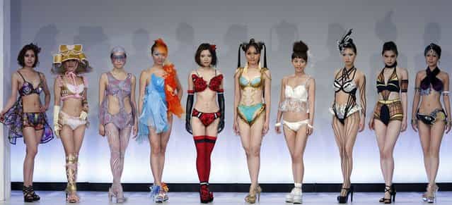 Models display lingerie designs in various themes as they pose at the Triumph Inspiration Award Japan at the Bunka Fashion College in Tokyo on May 30, 2012