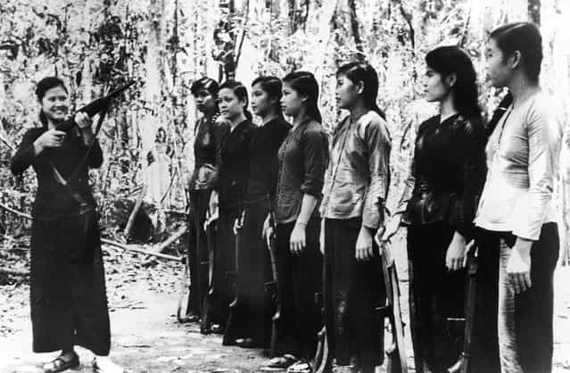 A small group of North Vietnamese women undergoing rifle training before joining Viet Cong forces during the Vietnam War, 11th September 1967. Their weapons are of American origin