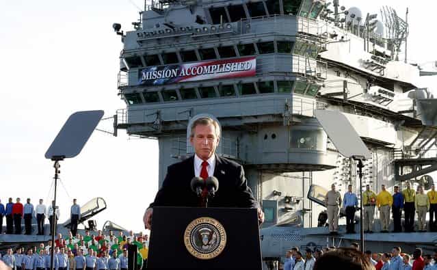 President George W. Bush declares the end of major combat in Iraq as he speaks aboard the aircraft carrier USS Abraham Lincoln off the California coast