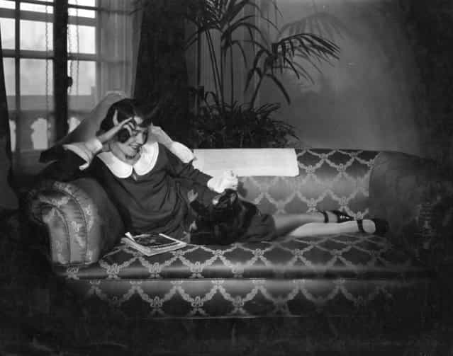 Actress Adele Astaire (1898–1981) relaxing with her toy monkey, 1926