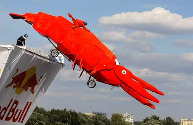 A makeshift aircraft is launched from a platform into the Moskva River during the Red Bull Flugtag Moscow 2011 competition in the Russian capital. (Photo by Mikhail Metzel/Associated Press)