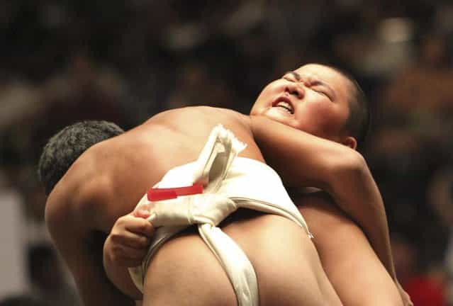 LaPresseIn this Sunday, July 29, 2012 photo, an elementary school sumo wrestler reacts after his bout at the National Childrens Sumo tournament in Tokyo. 