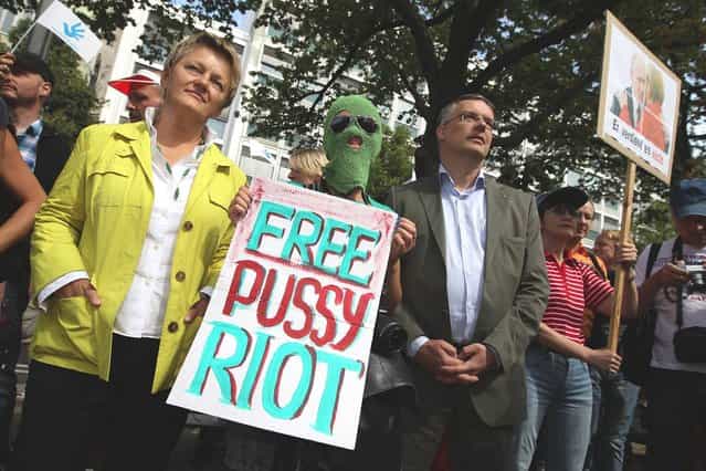 Renate Kuenast (L) of the German Greens Party and Markus Loening, German Federal Human Rights Commissioner, join supporters of the Russian female punk band Pussy Riot protesting outside the Russian embassy on August 17, 2012 in Berlin, Germany. A Moscow court is scheduled to announce a verdict in the trial of the three musicians later today in a case that has attracted global attention over the issues of freedom of speech and artistic expression in modern Russia. (Photo by Sean Gallup) 