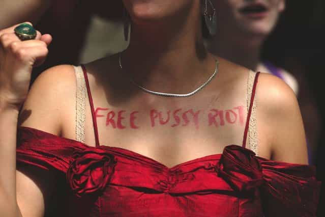 A woman wears on her chest the text 'free pussy riot' as a demonstration by supporters of the jailed feminist punk band 'Pussy Riot' takes place outside the Russian Embassy on August 17, 2012 in London, England. The three women who staged an anti-Kremlin protest in a church in February, were found guilty today of hooliganism motivated by religious hatred, and could face a three-year jail sentence. Supporters are gathering in several cities around the world today as a mark of solidarity. (Photo by Dan Kitwood)