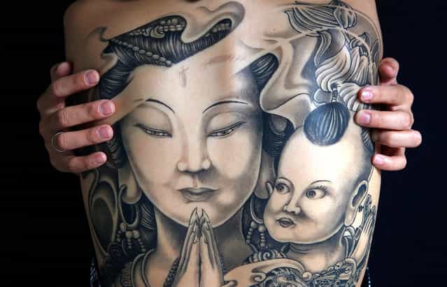 Artwork on the back of Yi-jun, shown during the 2010 Taiwan International Tattoo Convention in Taipei, on July 31, 2010. The convention aimed to gather people from all over the world to promote the industry and garner positive thinking towards tattoos. (Photo by Nicky Loh/Reuters)