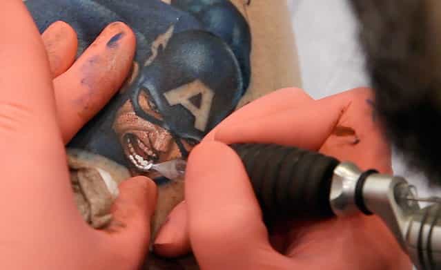 A tattoo of Captain America drawn by artist Sean Karon on the leg of client Ron Raucci at the Hampton Roads Tattoo Festival in Virginia, on March 2, 2012. The tattoo was completed from start to finish in one five-and-a-half hour session and won the prestigious [tattoo of the day] contest. (Photo by Jason Reed/Reuters)
