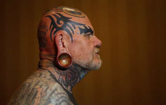 Robert Seibert, 62, from Burlington, Kentucky, shows off his full body of tattoos, including the tribal-inspired designs he has accumulated over 40 years, during the National Tattoo Association Convention in Cincinnati, Ohio, on April 14, 2012. Of his art, Seibert says, [I'm one of the people that can't have a favorite tattoo, each is like a certain phase of my life. To me it's a picture history of what I have gone through, through the years]. (Photo by Jason Reed/Reuters)
