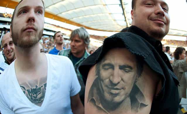 A Bruce Springsteen fan shows his tattoo at the opening concert of Springsteen's [Wrecking Ball] world tour at the Commerzbank Arena in Frankfurt, on May 25, 2012. (Photo by Thomas Lohnes/AP Photo)