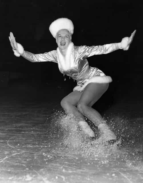 Sheila Hamilton makes the ice fly during a rehearsal of one of her numbers [Winter Wonderland] in the [Cinderella] Ice show at the Empire Pool Wembley. 12th December 1952. (Photo by Fox Photos)