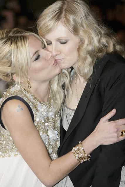 Actress Sienna Miller (L) and her sister Savannah embrace at the UK premiere of [Factory Girl] at Vue West End on March 13, 2007 in London, England. (Photo by Dave Hogan)