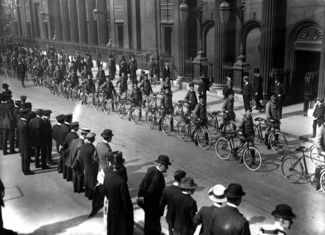 Automobile Association bicycle scouts in procession on their way to Liverpool Street Station, en route to camp, September 1914.