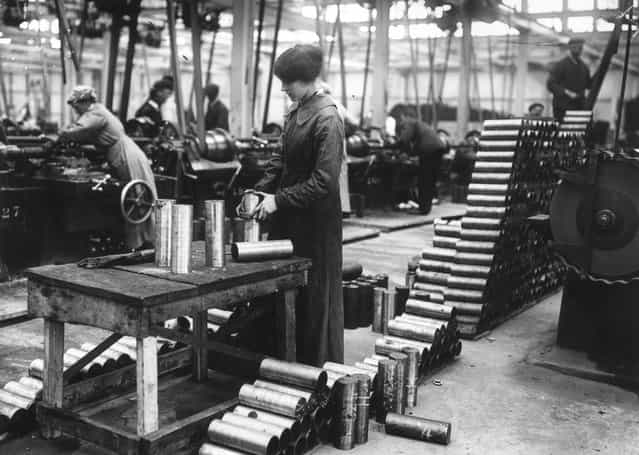 Women munitions workers in a Vickers factory maing shell cases, January 1915. (Photo by Topical Press Agency)