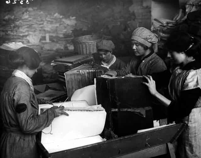 Women pulling apart old ledgers as part of the London & South West Railway's scheme to recycle paper. 16th April 1917. (Photo by Topical Press Agency)