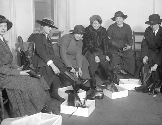 Women police appointed for duty at a munitions works trying on new boots. United Kingdom, 30th January 1917. (Photo by A. R. Coster/Topical Press Agency)