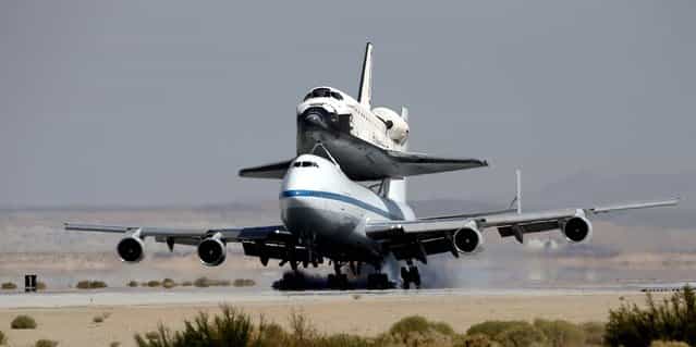 Space shuttle Endeavour mounted on NASA's Shuttle Carrier Aircraft (SCA) lands at Edwards Air Force Base, California on Thursday. (Photo by Jae C. Hong/Associated Press)