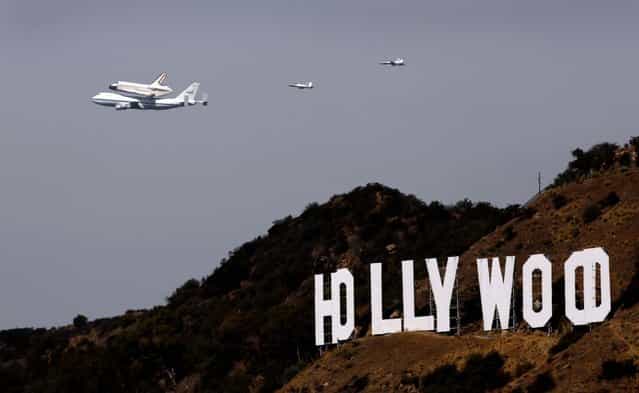 The space shuttle Endeavour passes the iconic Hollywood sign in Los Angeles. (Photo by Al Seib/Los Angeles Times/MCT)