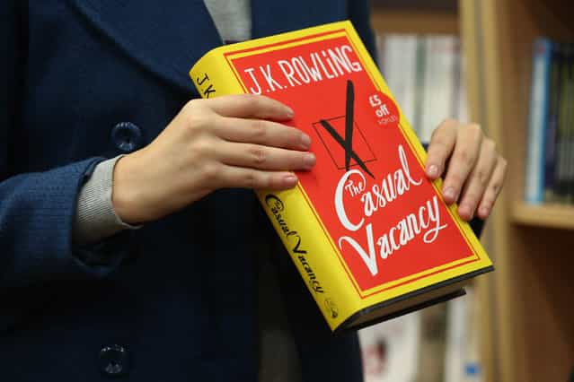 A woman at Foyles bookshop holds a copy of J. K. Rowling's latest novel 'The Casual Vacancy' which has gone on sale today starting at 8:00 am on September 27, 2012 in London, England. 'The Casual Vacancy' is J. K. Rowling's first book aimed at an adult readership and is centered on a parish council election in a small West Country town. (Photo by Oli Scarff)