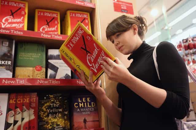 A woman at Foyles bookshop looks at a copy of J. K. Rowling's latest novel 'The Casual Vacancy' which has gone on sale today starting at 8:00 am on September 27, 2012 in London, England. 'The Casual Vacancy' is J. K. Rowling's first book aimed at an adult readership and is centered on a parish council election in a small West Country town. (Photo by Oli Scarff)