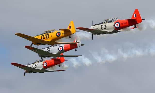 ARDMORE, NEW ZEALAND - SEPTEMBER 28: The Roaring 40's Harvard display team perform during an airshow commemorating the rebuild of Havilland Mosquito KA 114, on September 29, 2012 in Ardmore, New Zealand. The plane was restored by Warbird Restorations at Ardmore Aerodrome and is the only flying Mosquito in the world. (Photo by Simon Watts)