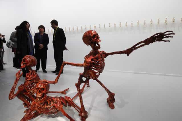Martine Aubry (C), mayor of Lille, visits the exhibition called [Desesperanza] by French artist Theo Mercier at the Tri Postal exhibition hall during the Lille 3000 [Fantastic] event in Lille October 5, 2012. Festivities of Lille 3000 [Fantastic] will start with the opening parade on October 6, under the theme of [Urban Metamorphosis], and will continue until January 13, 2013 with major exhibitions. (Photo by Pascal Rossignol/Reuters)