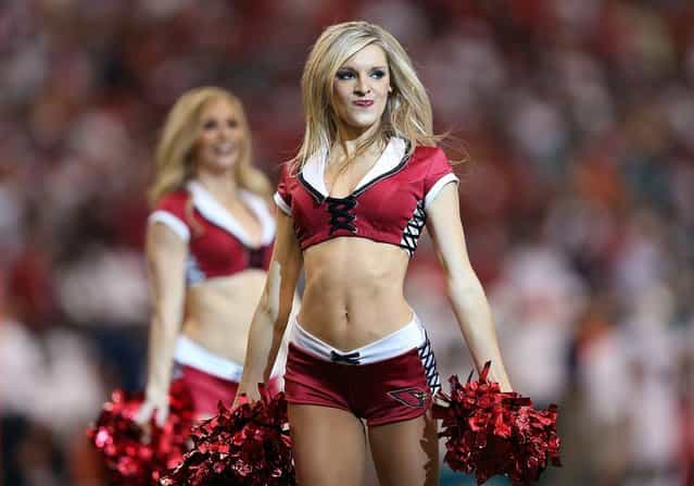 The Arizona Cardinals cheerleaders perform during the NFL game against the Miami Dolphins at the University of Phoenix Stadium on September 30, 2012 in Glendale, Arizona. The Carindals defeated the Dolphins 24-21 in overtime. (Photo by Christian Petersen)