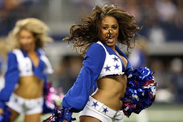 Cheerleaders for the Dallas Cowboys perform against the Chicago Bears at Cowboys Stadium on October 1, 2012 in Arlington, Texas. (Photo by Ronald Martinez)