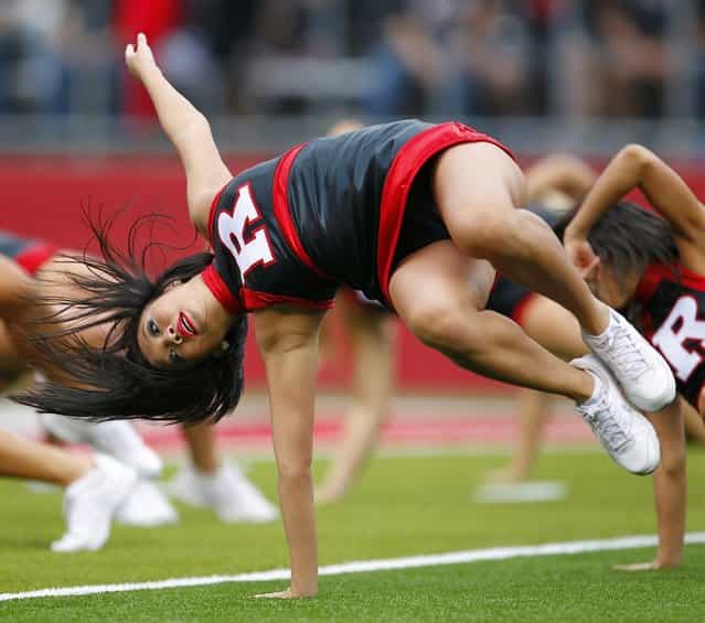 Rutgers Scarlet Knights cheerleaders perform during a game against the Connecticut Huskies at High Point Solutions Stadium on October 6, 2012 in Piscataway, New Jersey. Rutgers defeated Connecticut 19-3. (Photo by Rich Schultz)