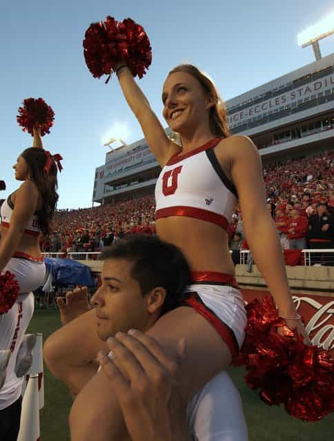 Utah Ute's cheerleaders cheer during a game against the USC Trojans during the first half of a college football game on October 4, 2012 at Rice-Eccles Stadium in Salt Lake City, Utah. (Photo by George Frey)