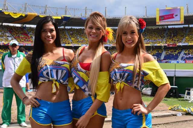 Colombian national football team cheerleaders pose as they wait for the Brazil 2014 World Cup South American qualifier match against Paraguay at the Metropolitano Stadium in Barranquilla, Colombia on October 12, 2012. (Photo by Luis Acosta/AFP Photo)