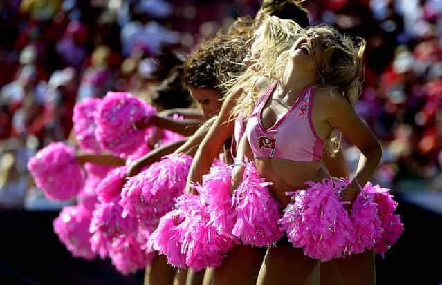 The Tampa Bay Buccaneers cheerleaders perform wearing pink during the Buccaneers' game against the Kansas City Chiefs in Tampa. (Photo by Phelan M. Ebenhack/Associated Press)