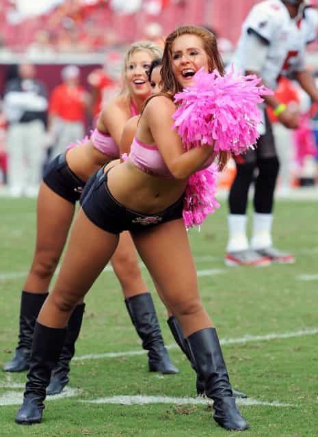 Tampa Bay Buccaneers cheerleaders perform during play against the Kansas City Chiefs October 14, 2012 at Raymond James Stadium in Tampa, Florida. (Photo by Al Messerschmidt)