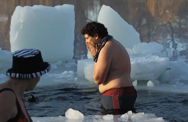 Ice swimming enthusiasts take to the frigid waters of Orankesee lake during the 27th annual [Winter Swimming in Berlin] on January 8, 2011 in Berlin, Germany. (Photo by Sean Gallup)