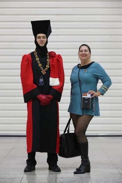 Chris Miller (L), dressed as 'Judge Q', and Brenda Havens, dressed as a Science Officer from The Original Series, arrive to attend the [Destination Star Trek London] convention at the ExCeL centre on October 19, 2012 in London, England. The three-day convention, which opened to the general public today, will be attended by all five actors who played captains throughout the 46-year-old series. (Photo by Oli Scarff)