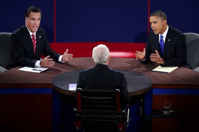 Romney and Obama talk over each other as they are questioned by moderator Bob Schieffer. (Photo by Win McNamee/Associated Press)