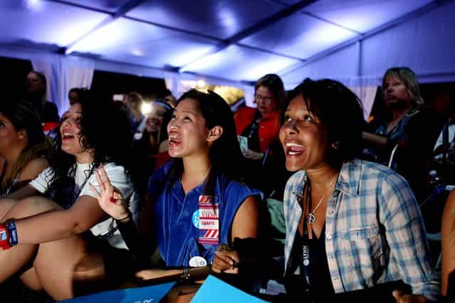 Lynn University students Estefanny Paulino of New York, Stefani Silva of Texas and Amanda Nguherimo of Maryland watch the debate at the Red, White and View party. (Photo by Gary Coronado/The Palm Beach Post)