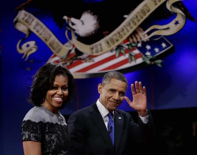 President Barack Obama and his wife Michelle walks off stage following the third presidential debate with Republican presidential nominee Mitt Romney at Lynn University, Monday, October 22, 2012, in Boca Raton, Fla. (Photo by Eric Gay/AP Photo)