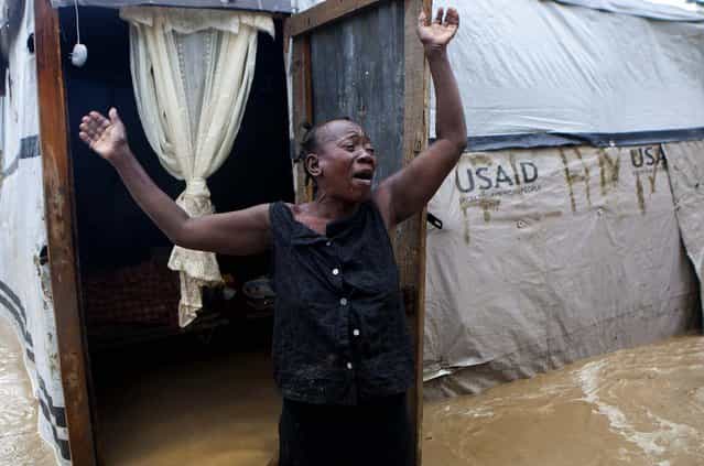 A woman cries out in front of her flooded house after heavy rains from Hurricane Sandy hit Port-au-Prince, Haiti on Thursday. (Photo by Dieu Nalio Chery/Associated Press)