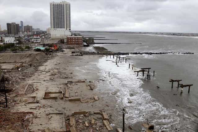 Foundations and pilings are all that remain of brick buildings and a boardwalk in Atlantic City, N.J. (Photo by Seth Wenig/Associated Press)