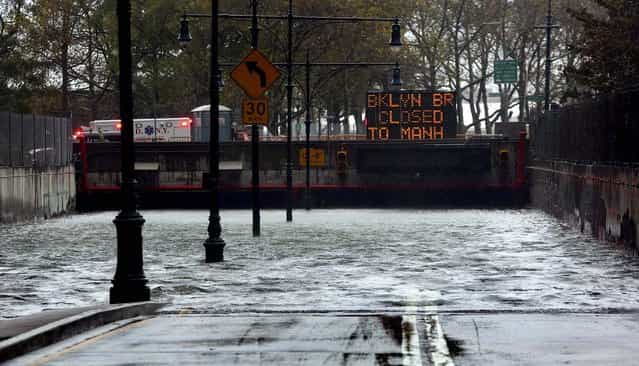 The Battery Park Underpass is submerged by floodwaters in New York City. (Photo by Michael Appleton/The New York Times)